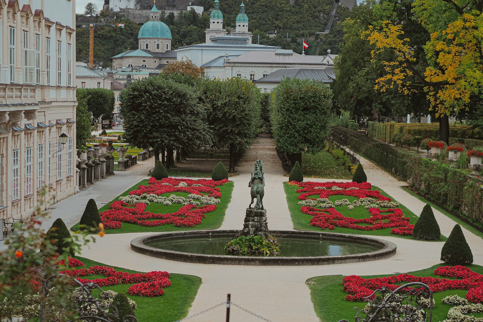 Formal garden with fountain and manicured hedges